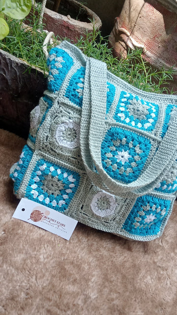 Grey crochet bag with blue flowers