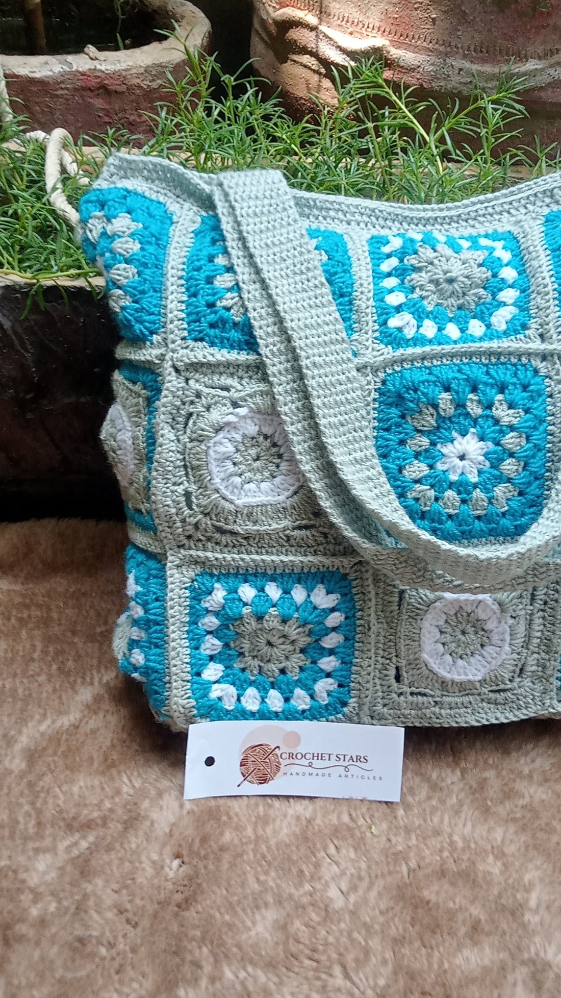 Grey crochet bag with blue flowers